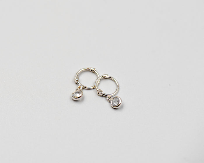 105 Earring featuring a hanging cubic zirconia.