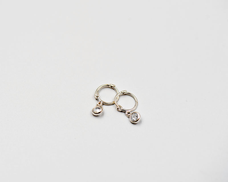 105 Earring featuring a hanging cubic zirconia.