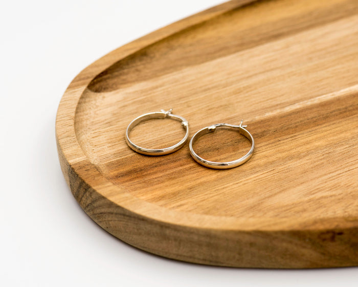 109 Earrings Elegant silver hoop earrings, measuring 2 x 20mm.