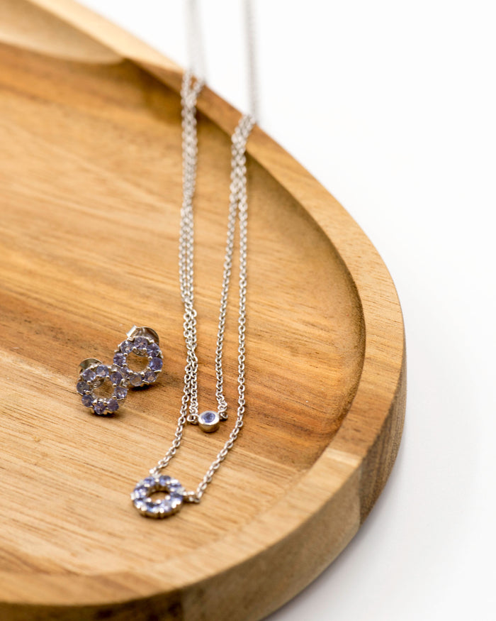 136 Elegant silver round earrings and chain set, featuring a combination round pendant with December tanzanite stones.