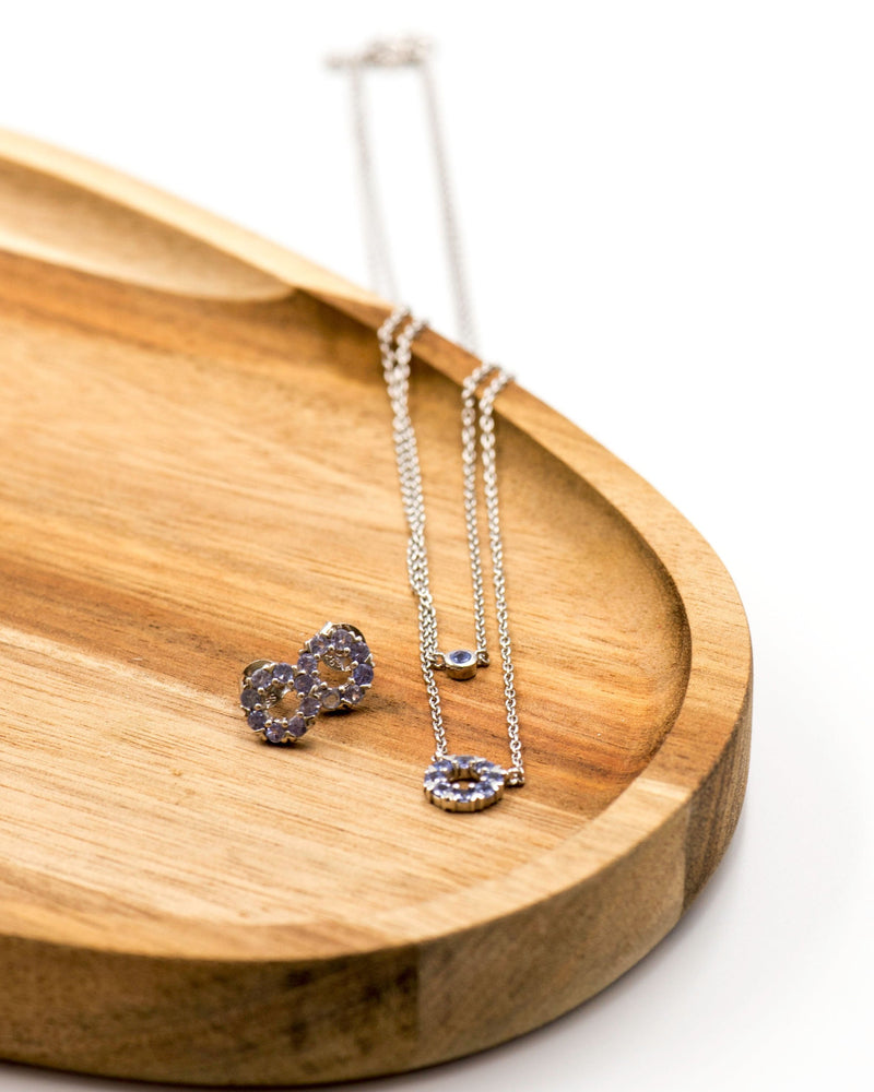 136 Elegant silver round earrings and chain set, featuring a combination round pendant with December tanzanite stones.