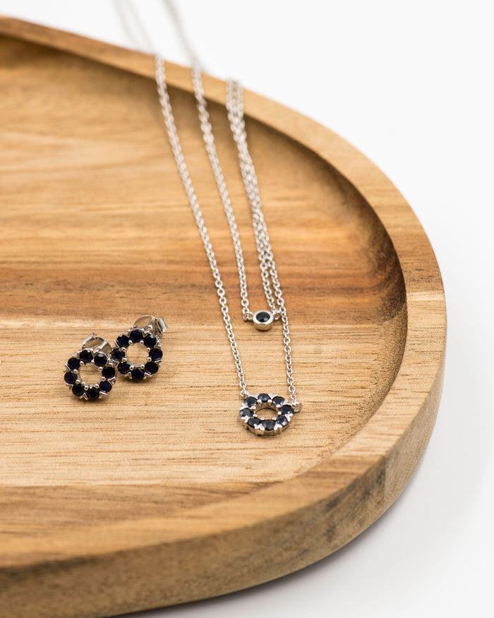 133 Elegant silver round earrings and chain set, featuring a combination round pendant with September sapphire stones.