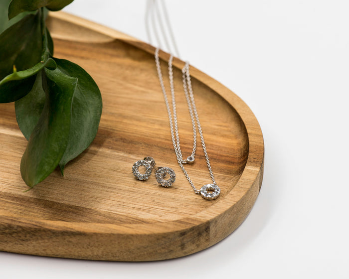 128 Elegant silver round earrings and chain set, featuring a combination round pendant with April white topaz stones