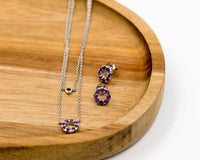 126 Set Chain and Earring Elegant silver round earrings and chain set, featuring a combination round pendant with February amethyst stones.