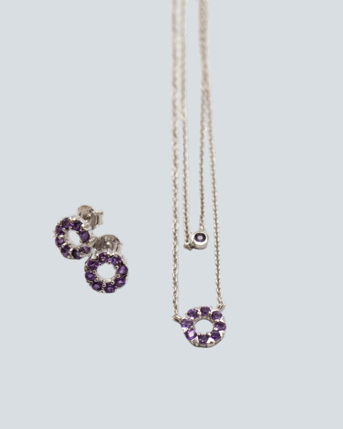 126 Set Chain and Earring Elegant silver round earrings and chain set, featuring a combination round pendant with February amethyst stones.