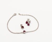 146 Elegant silver 3-piece set, featuring round earrings with 50mm July ruby stones, a matching pendant, and a bracelet with ruby stones.