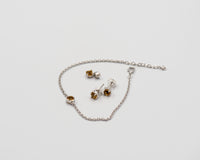 150 Elegant silver 3-piece set, featuring round earrings with 50mm November citrine stones, a matching pendant, and a bracelet with citrine stones.