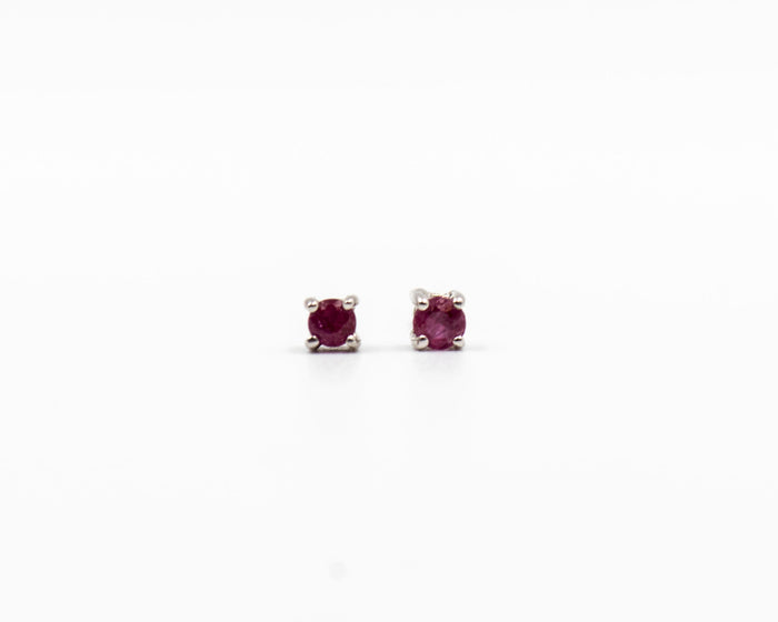 118 Earring Elegant silver 3mm stud earrings featuring a July ruby birthstone.