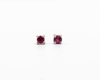 118 Earring Elegant silver 3mm stud earrings featuring a July ruby birthstone.