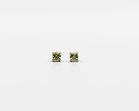 119 Earrings Elegant silver 3mm stud earrings featuring an August peridot birthstone.