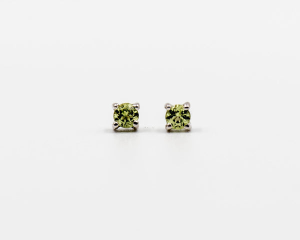 119 Earrings Elegant silver 3mm stud earrings featuring an August peridot birthstone.