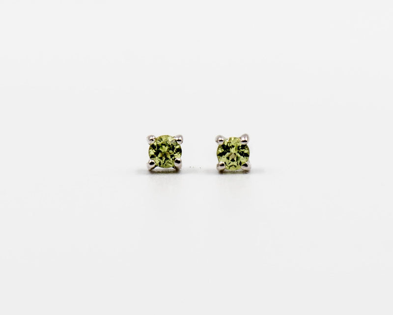 119 Earrings Elegant silver 3mm stud earrings featuring an August peridot birthstone.