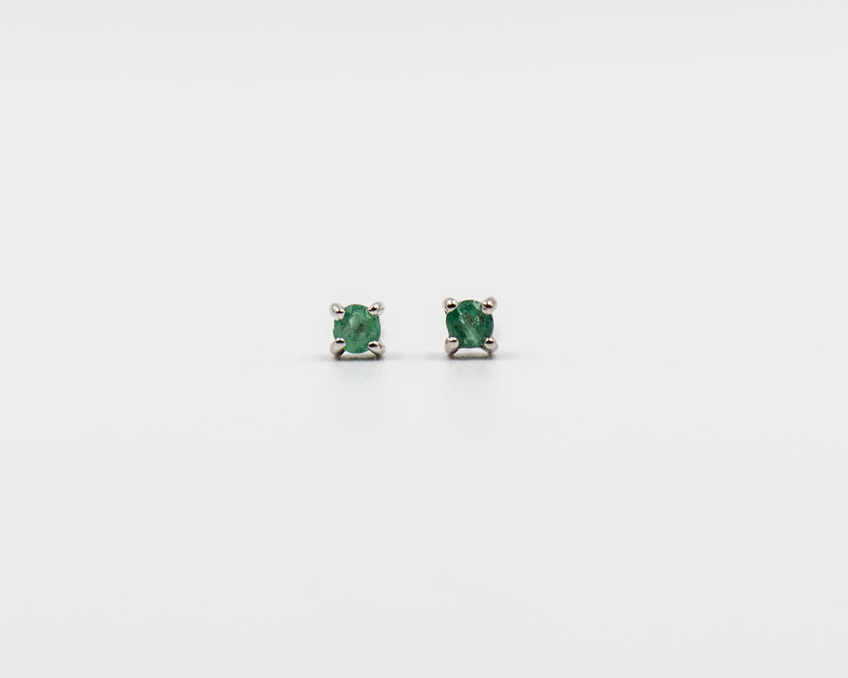 116 Earring Elegant silver 3mm stud earrings featuring a May emerald birthstone.