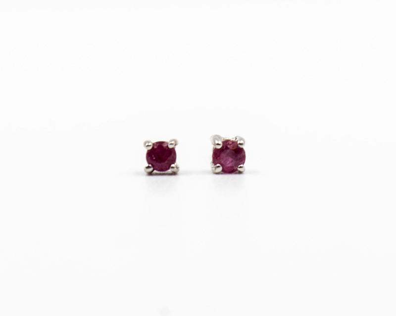 118 Earring Elegant silver 3mm stud earrings featuring a July ruby birthstone.