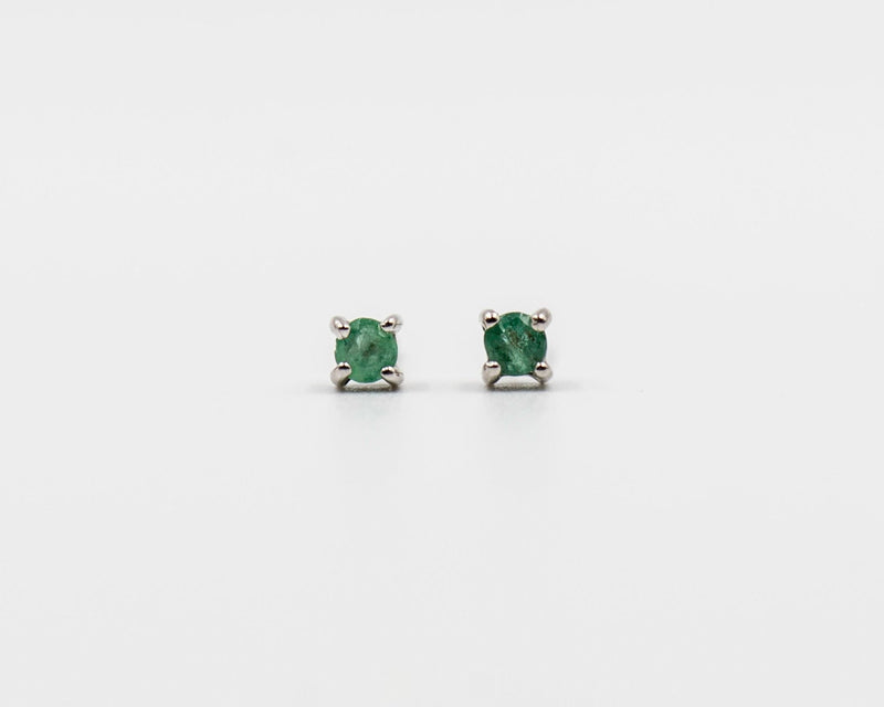 116 Earring Elegant silver 3mm stud earrings featuring a May emerald birthstone.